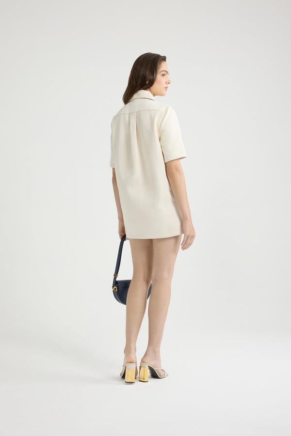 Patou - Vestito mini con zip in denim di cotone - Natural - Vestito in denim di cotone naturale écru. Lunghezza mini. Taglio dritto. Colletto largo. Zip oro sul davanti. Tasche a toppa con medaglione oro inciso con il logo Patou Piega sul retro.Questo modello è molto corto.