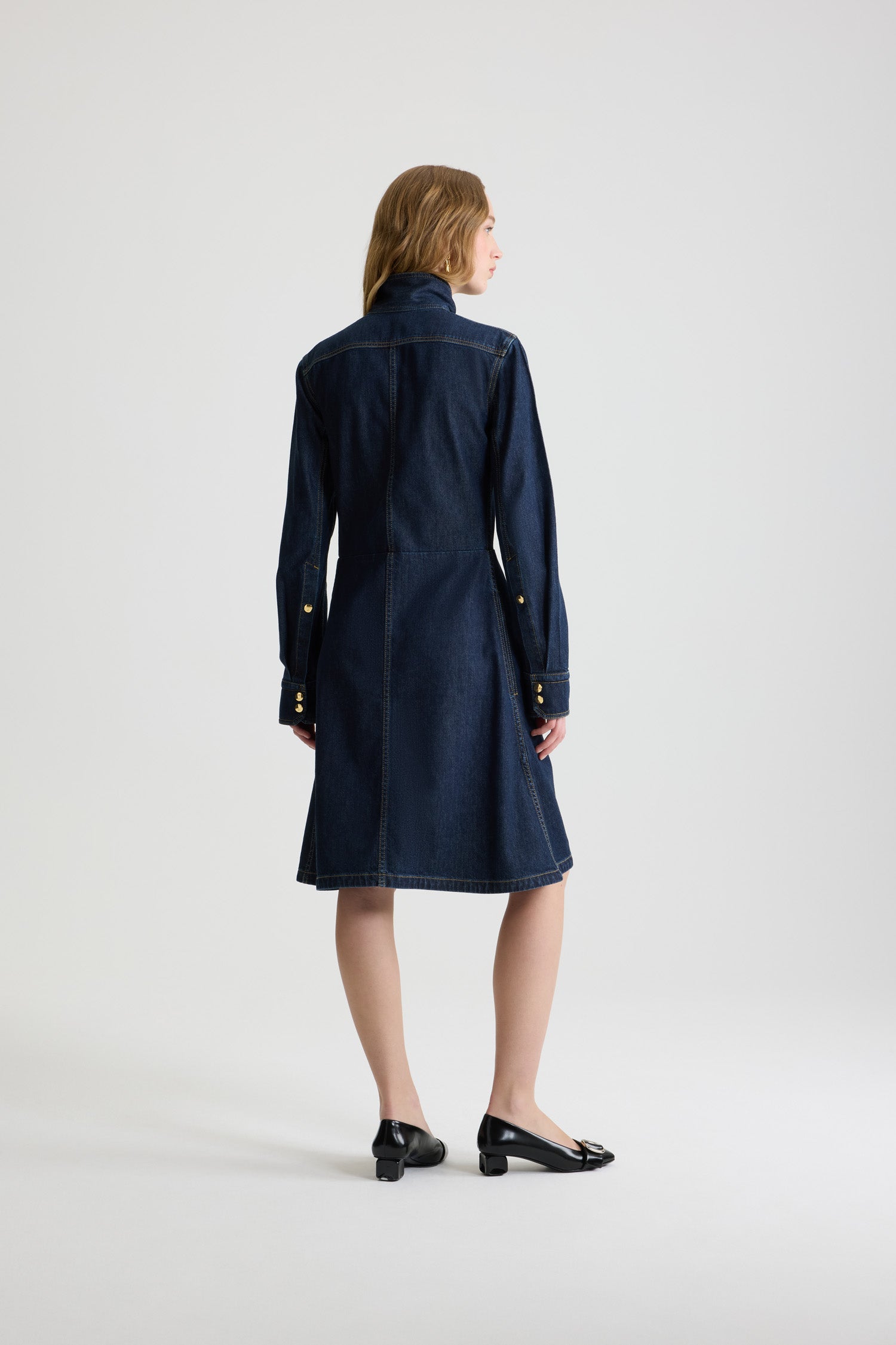 Patou - Scarf collar shirt dress in cotton blend denim - Blue Moon Rodeo - Blue Moon Rodeo cotton blend denim dress. Striped pattern. Knee length. Fit and flare silhouette. Scarf collar with loop at the front. Concealed button front fastening. Patou logo embroidered at the waist. Buttoned cuffs. Pockets at the sides.