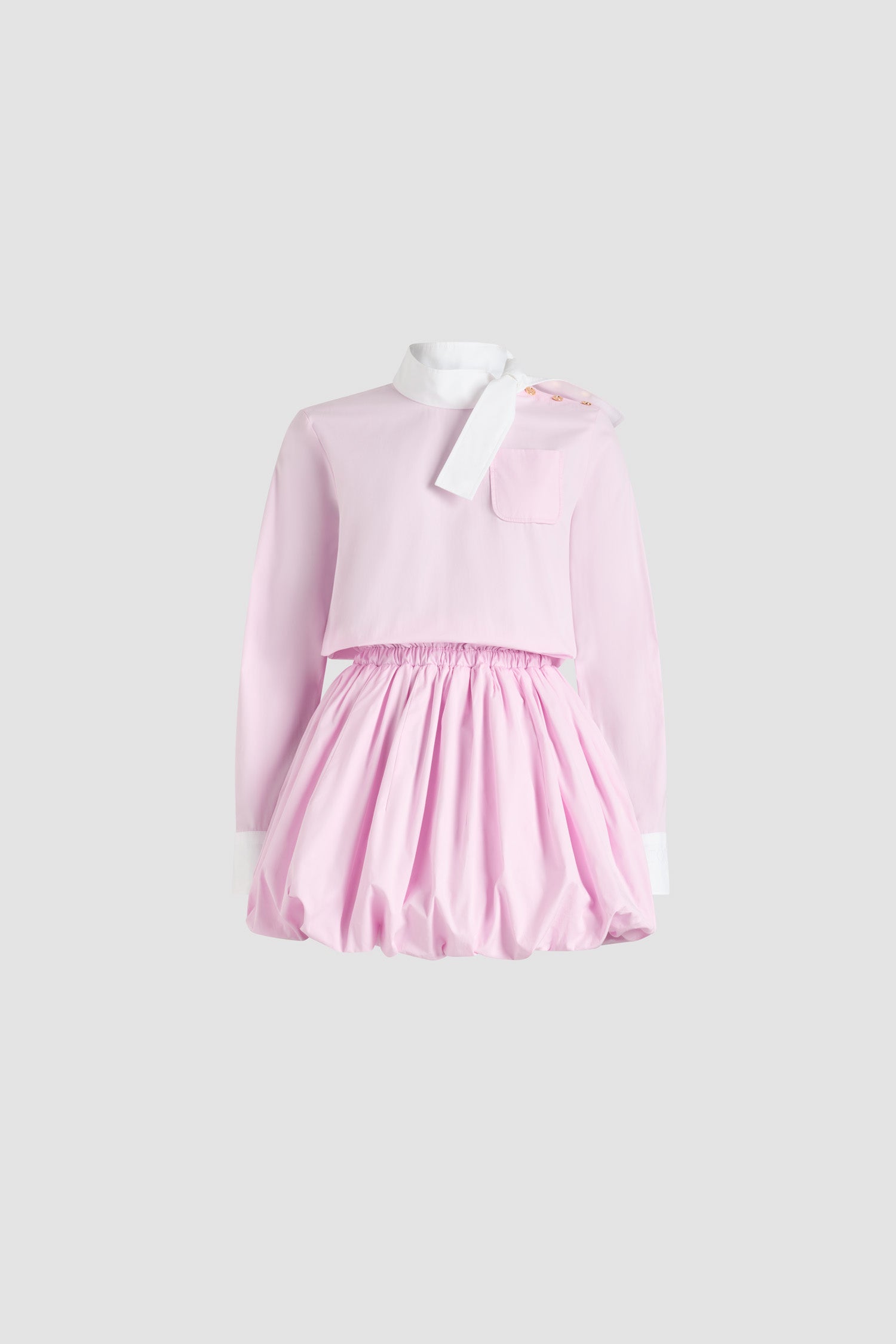 Patou - Bubble mini dress in organic cotton poplin - Pink Pearl - Pink Pearl organic cotton poplin dress. Short length. Contrast scarf collar. Chest patch pocket. Elasticated waist. Embroidered Patou logo on the left cuff. Contrast buttoned cuffs. Pockets at the side. Bubble hem.