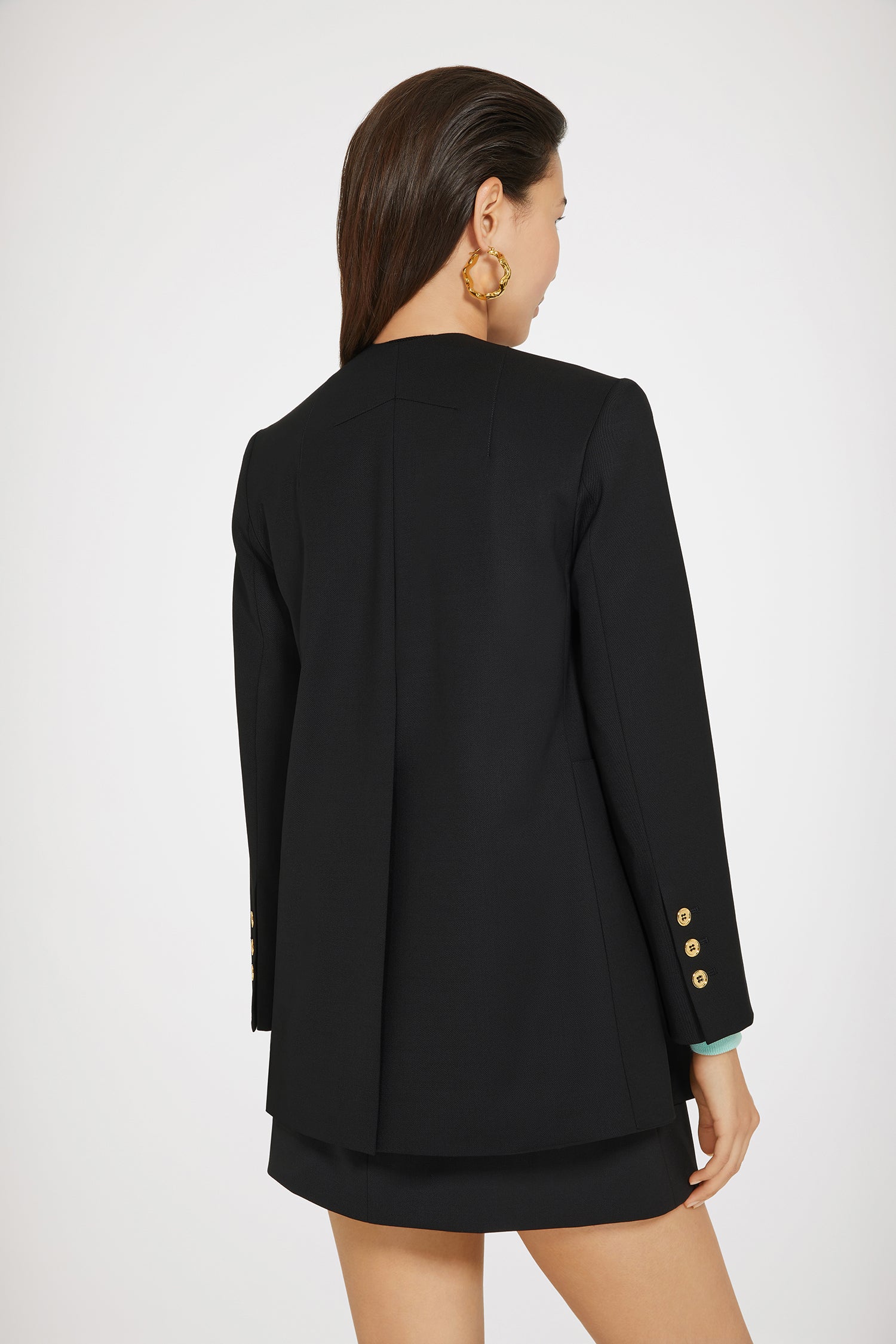 Patou - Collarless double-breasted wool jacket - Black - The collarless (r)evolution.Double-breasted collarless black virgin wool jacket. Gold buttons at the front and on the cuffs. Slit pocket at the chest, two oversized flap pockets. Tailor-style Patou label on the sleeve. Fully lined.
