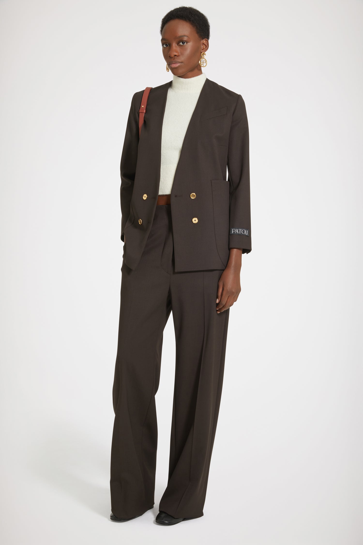 Patou - Collarless double-breasted jacket in technical wool twill - Chocolate - The collarless (r)evolution.Chocolate brown technical wool twill jacket. Double-breasted silhouette. Collarless design. Gold-tone JP-engraved buttons at the front and on the cuffs. Slit pocket at the chest, two oversized patch pockets. Patou label on the left sleeve. Fully lined.
