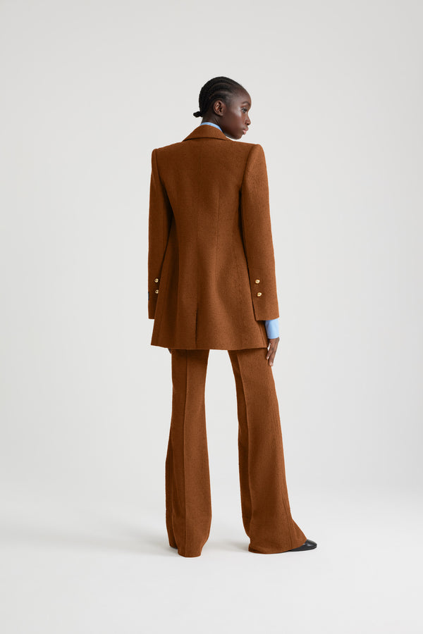 Patou - Double-breasted jacket in sustainable wool and organic cotton tweed - Autumn Leaf - Autumn Leaf brown sustainable wool and organic cotton tweed jacket. Slim longline silhouette. Double-breasted construction. Peak lapels. Gold-tone half-sphere JP buttons. Flap pockets. Buttoned cuffs. Patou label on the left sleeve. Single vent. Lined.This style is fitted at the waist and is cut for a mid-thigh length.