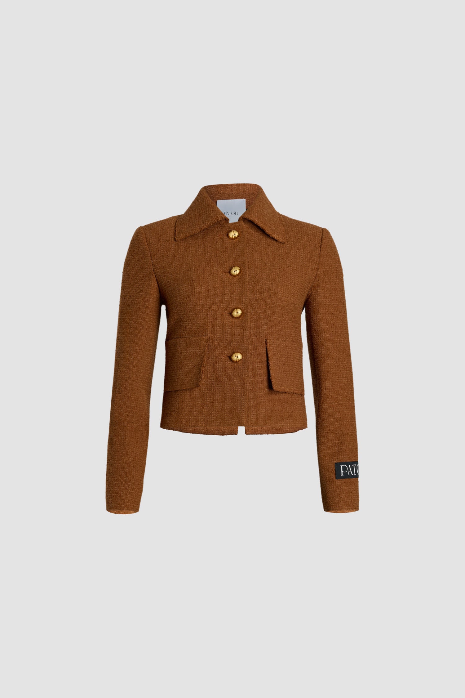 Patou - Iconic short jacket in sustainable wool and organic cotton tweed - Autumn Leaf - Autumn Leaf brown sustainable wool and organic cotton tweed jacket. Cropped length. Wide collar. Gold-tone Patou-engraved buttons. Patch pockets. Patou label on the left sleeve. Split cuffs. Lined.This style is short and fitted.