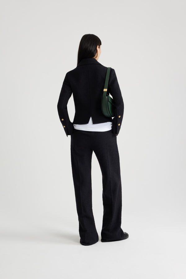 Patou - Iconic short jacket in sustainable wool and organic cotton tweed - Black - Black sustainable wool and organic cotton tweed jacket. Cropped length. Wide collar. Gold-tone Patou-engraved buttons. Patch pockets. Patou label on the left sleeve. Split cuffs. Lined.This style is short and fitted.