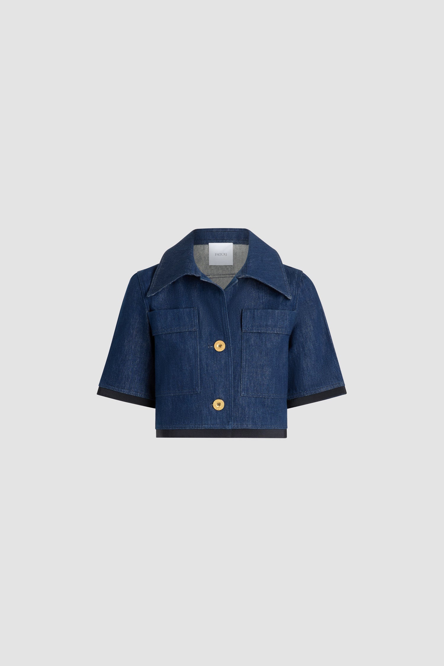 Patou - Short-sleeved cropped jacket in cotton denim - Rodeo Blue - Rodeo Blue cotton denim jacket. Cropped length. Wide collar. Gold-tone Patou logo-engraved buttons. Chest patch pockets. Elbow-length sleeves. Grosgrain trim at the cuffs and hem.