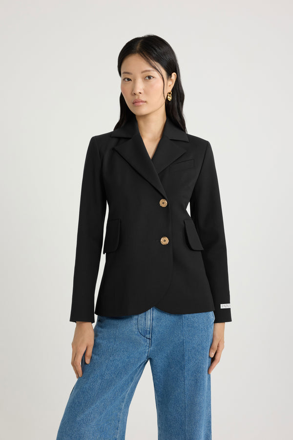 Patou - Fitted belted jacket in sustainable technical wool twill - Black - Black sustainable technical wool twill jacket. Fitted tailored silhouette. Double-breasted construction. Notch lapels. Gold-tone JP monogram-engraved buttons. Chest welt pocket, flap pockets. Removable self-tie belt at the waist. Split cuffs. Patou logo label on the left sleeve. Lined.