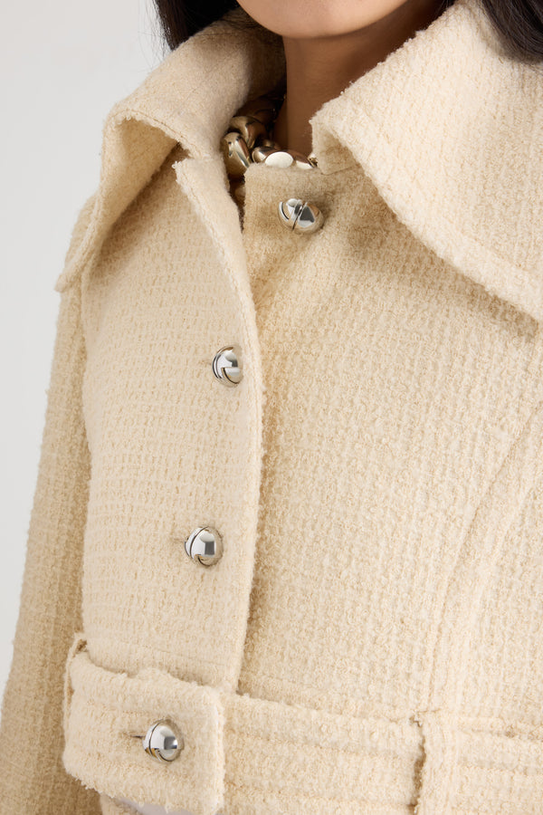 Patou - Belted cropped jacket in sustainable wool blend tweed - No Label Snowberry White - Snowberry White sustainable wool blend tweed jacket. Cropped silhouette. Single-breasted construction. Wide collar. Button front fastening with silver-tone JP monogram buttons. Buttoned belt at the waist that can be worn open. Slightly flared sleeves. Lined.