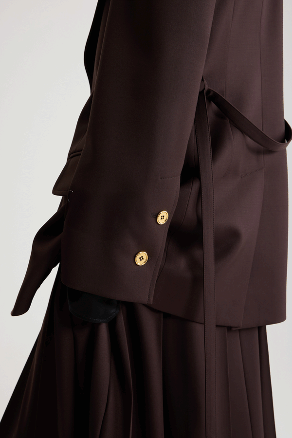 Patou - Longline single-breasted jacket in sustainable technical wool - No Label Smoked Ebony - Smoked Ebony sustainable technical wool twill jacket. Long tailored silhouette. Single-breasted construction. Wide notch lapel. Single gold-tone JP monogram-engraved button. Removable thin self-tie fabric belt at the waist. Buttoned cuffs. Lined.