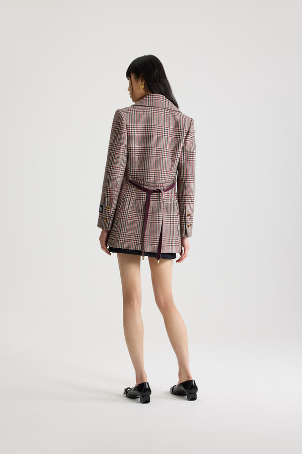 Patou - Longline single-breasted jacket in sustainable wool flannel - Prince Of Wales - Sustainable virgin wool flannel jacket. Prince of Wales pattern. Long tailored silhouette. Single-breasted construction. Wide notch lapel. Single gold-tone JP monogram-engraved button. Removable thin self-tie fabric belt at the waist. Patou logo label on the left sleeve. Buttoned cuffs. Lined.