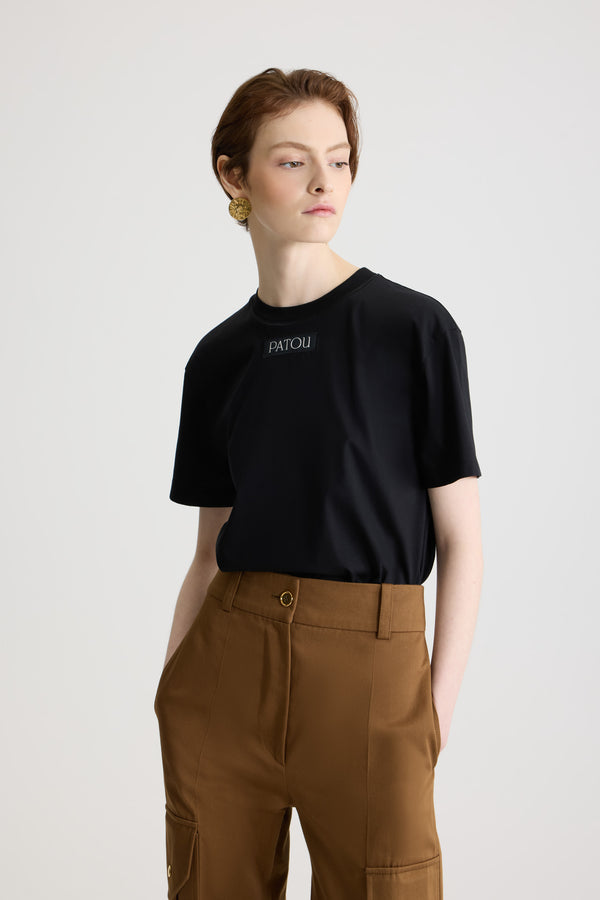 Patou - Patou logo label t-shirt in organic cotton - Black - Black organic cotton t-shirt. Regular fit. Crewneck. Patou logo label sewn at the front.