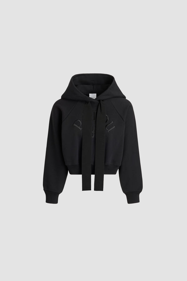 Patou - Patou logo and JP monogram hoodie in organic cotton - Black - Black organic cotton sweatshirt. Cropped length. Hooded collar with grosgrain drawstring. Embroidered Patou logo and JP monogram at the front. Raglan sleeves. Ribbed cuffs and hem.