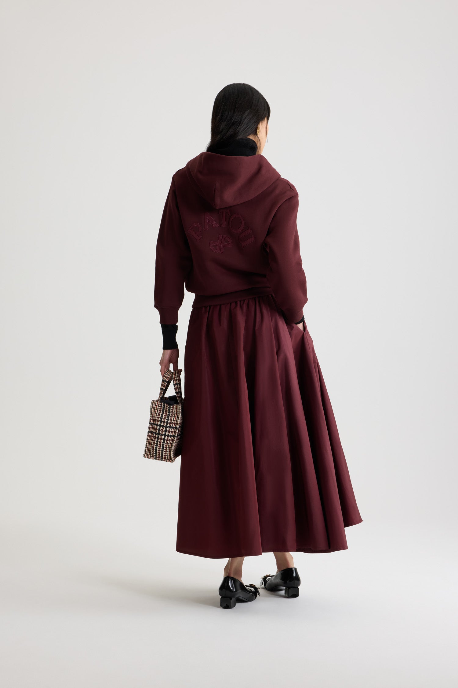 Patou - Patou logo and JP monogram zip-up hoodie in organic cotton fleece - Syrah - Syrah burgundy organic cotton fleece hoodie. Hooded collar with grosgrain drawstring. Gold-tone zip at the front. Embroidered Patou logo and JP monogram at the back. Side pockets. Ribbed cuffs and hem.