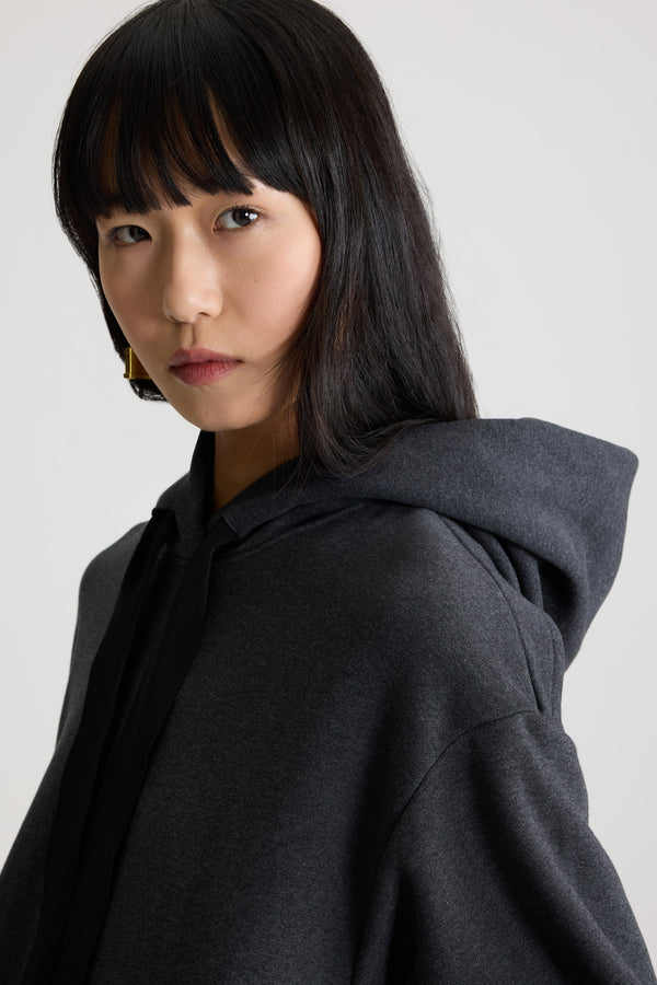 Patou - Ruffle hem hoodie dress in organic cotton and faille - Mercury - Mercury grey organic cotton hoodie. Contrast hem with a polyester faille ruffle. Hooded collar with grosgrain drawstring. Embroidered Patou logo at the front. Ribbed cuffs.