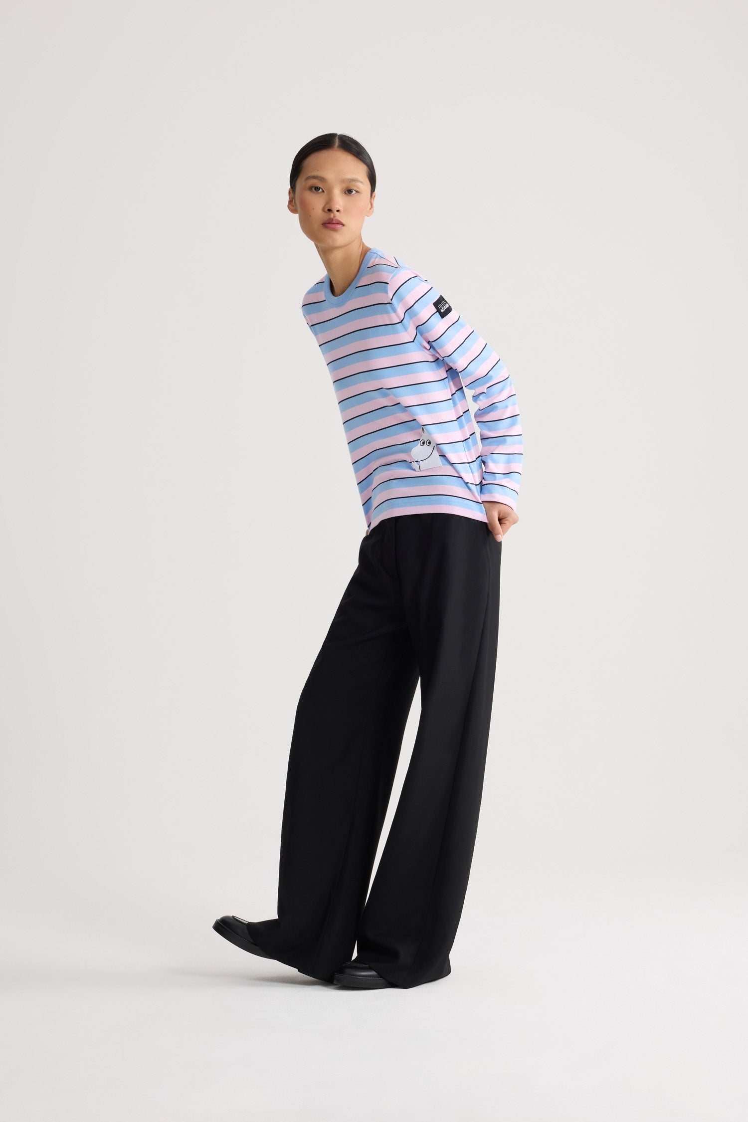 Patou - Patou x Moomin Long Sleeve Organic Cotton Tee - Moomin Stripes - Celebrate the holidays with the Patou x Moomin collaboration. This chic long-sleeve Tee features a comfortable shape crafted from 100% organic cotton. The shirt showcases a timeless striped pattern, adorned with an embroidered Moomin character, adding a touch of whimsy and nostalgia to your wardrobe. Perfect for adding a playful elegance to any outfit.Unisex look (select one size up for men).