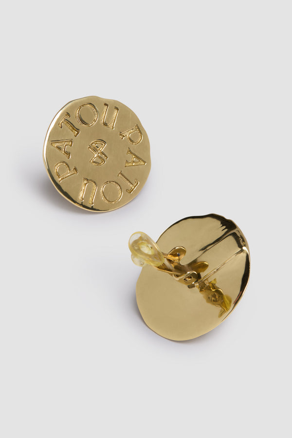 Patou - Coin clip earrings in gold-plated brass - Gold - Patou&#39;s golden coins are the ultimate style currency.Gold-plated brass clip earrings. Antique coin inspiration. Hammered texture. Engraved Patou logo with JP monogram at the center. Clip-on design.