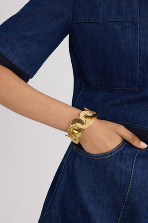 Bracciale monete in ottone dorato