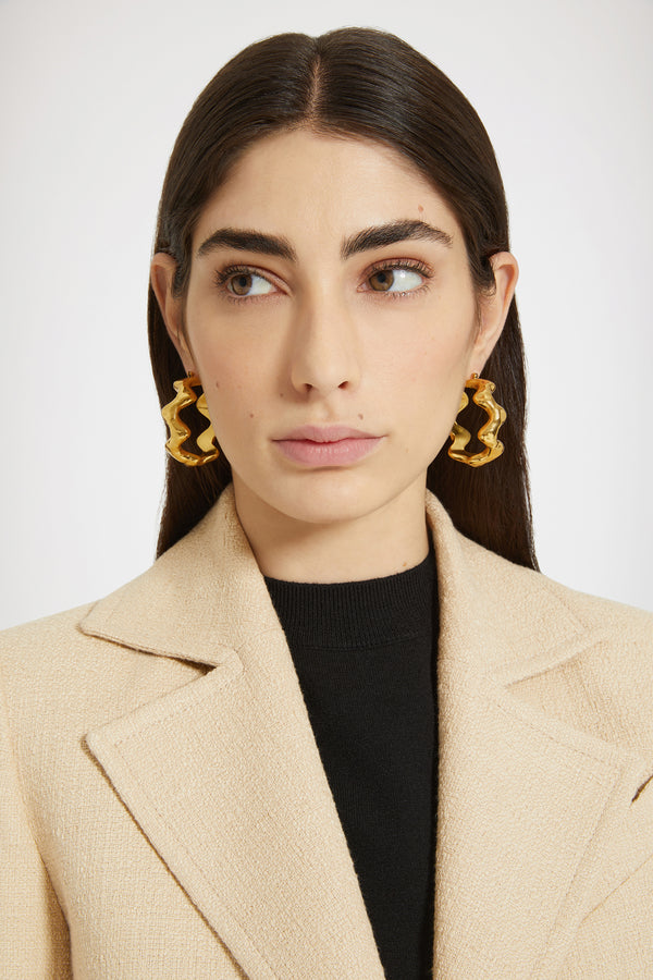 Patou - Wave hoop earrings in gold-plated brass