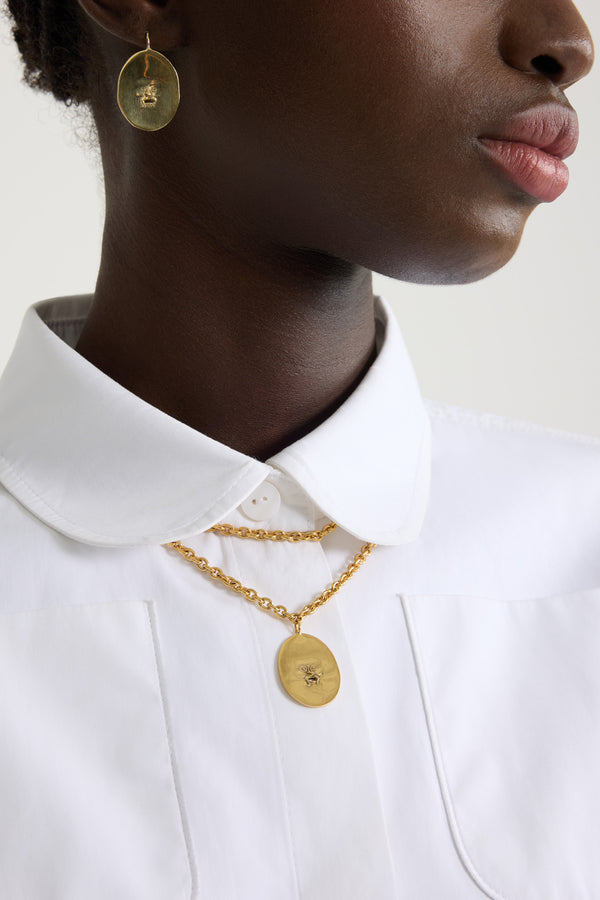 Patou - Collana con ciondolo Bocca in ottone - Gold - Una figura antica diventa una signature iconica.Collana in ottone dorato. Doppia catena. Ciondolo ovalo con ritagli ispirati alla Bocca della Verità.