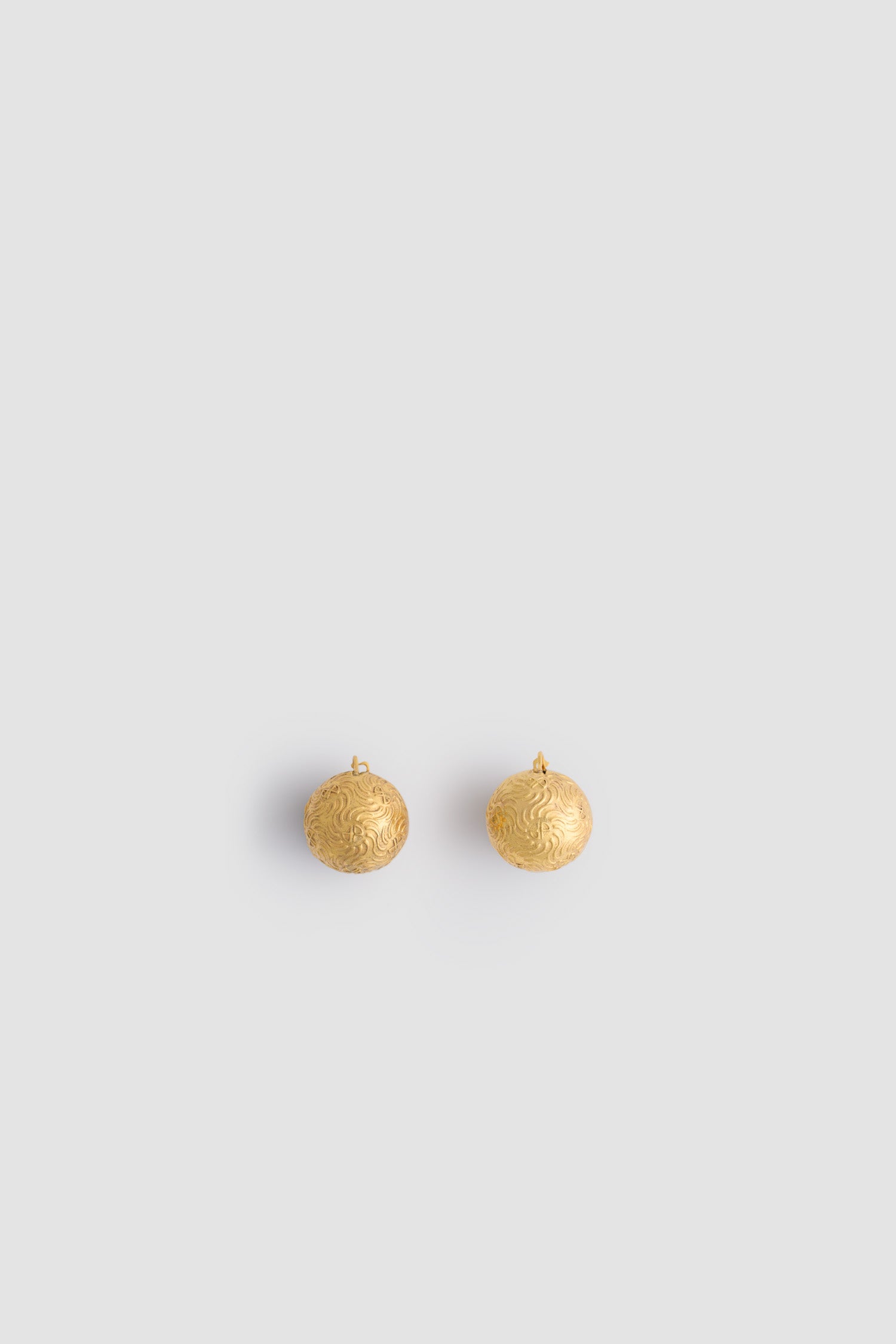 Patou - Engraved sphere earrings in gold-plated brass - Gold - Gold-plated brass earrings. Spheres engraved with sun motifs and JP monograms. Engraved Patou. French lock fastening suitable for pierced ears.