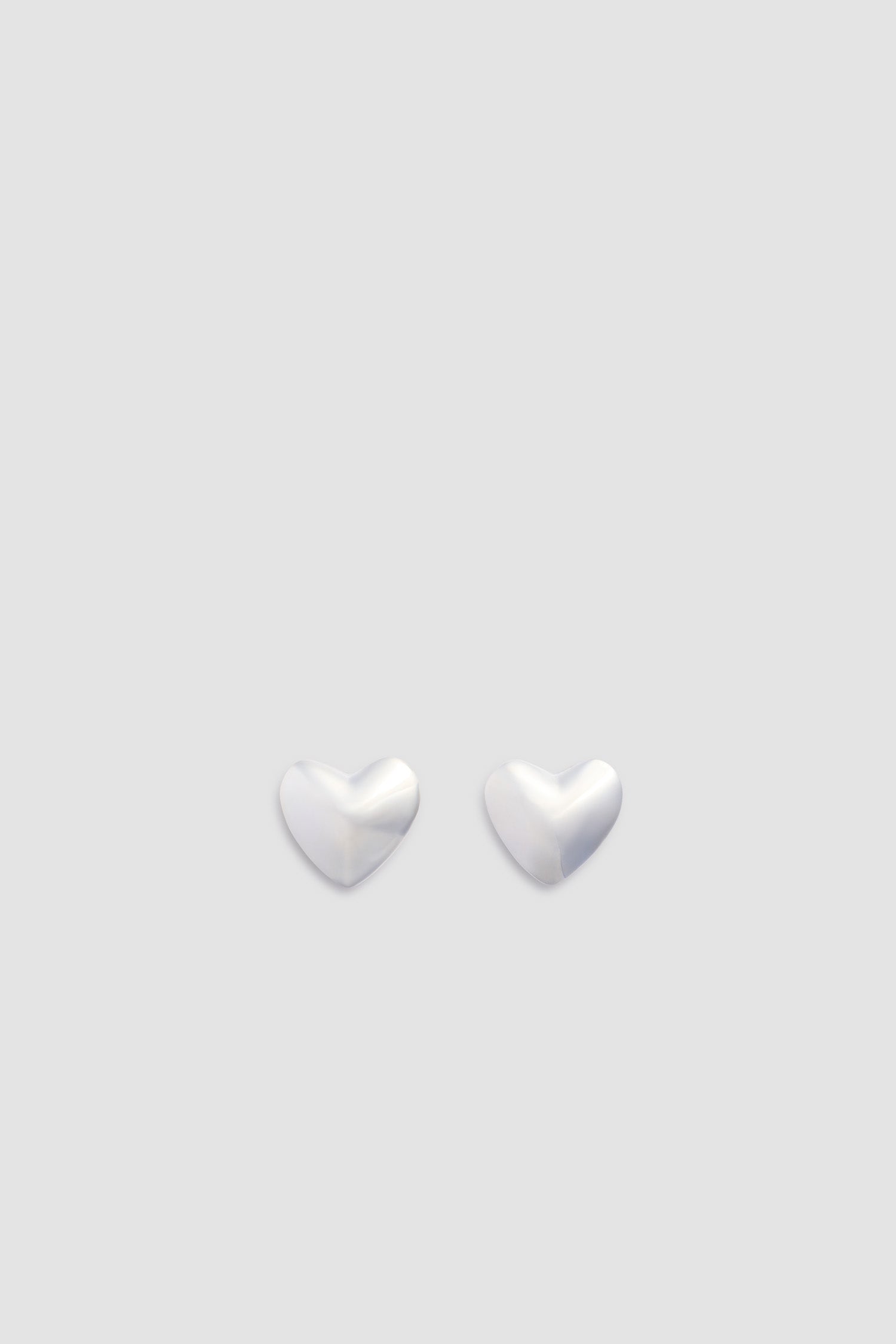 Patou - M Heart Stud Earrings - Silver - Heart-shaped stud earrings in silver-colored brass. Brushed and contrasted surface.