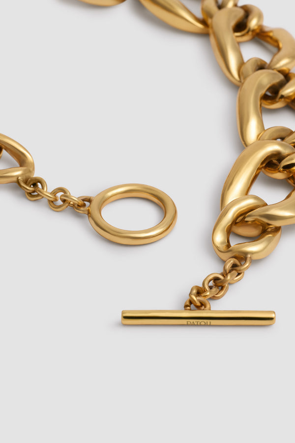 Patou - Collier chaîne à cœur en laiton doré - Gold - Collier en laiton doré. Modèle court en forme de chaîne. Pendentif cœur. Fermoir en T.