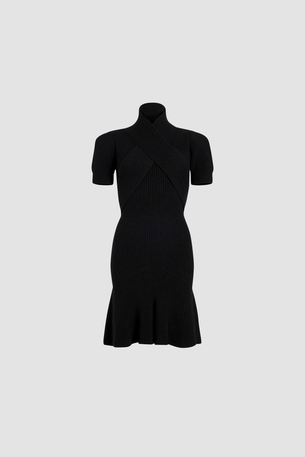 Patou - Vestito con bustino incrociato in misto lana e cachemire ecosostenibile - Black - Vestito in misto lana e cashmere ecosostenibile nero. Silhouette aderente. Collo alto. Bustino incrociato. Maniche corte. Pieghe sulla gonna.Questo modello è aderente.