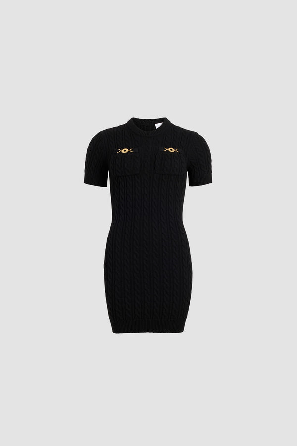 Patou - Cable mini dress in wool and cashmere - Black - Black Merino wool and cashmere dress. Cable stitch. Short length. Fitted silhouette. Round neck. Two chest pockets with gold-tone Patou logo-engraved medallion embellishments. Ribbed collar, cuffs and hem.
