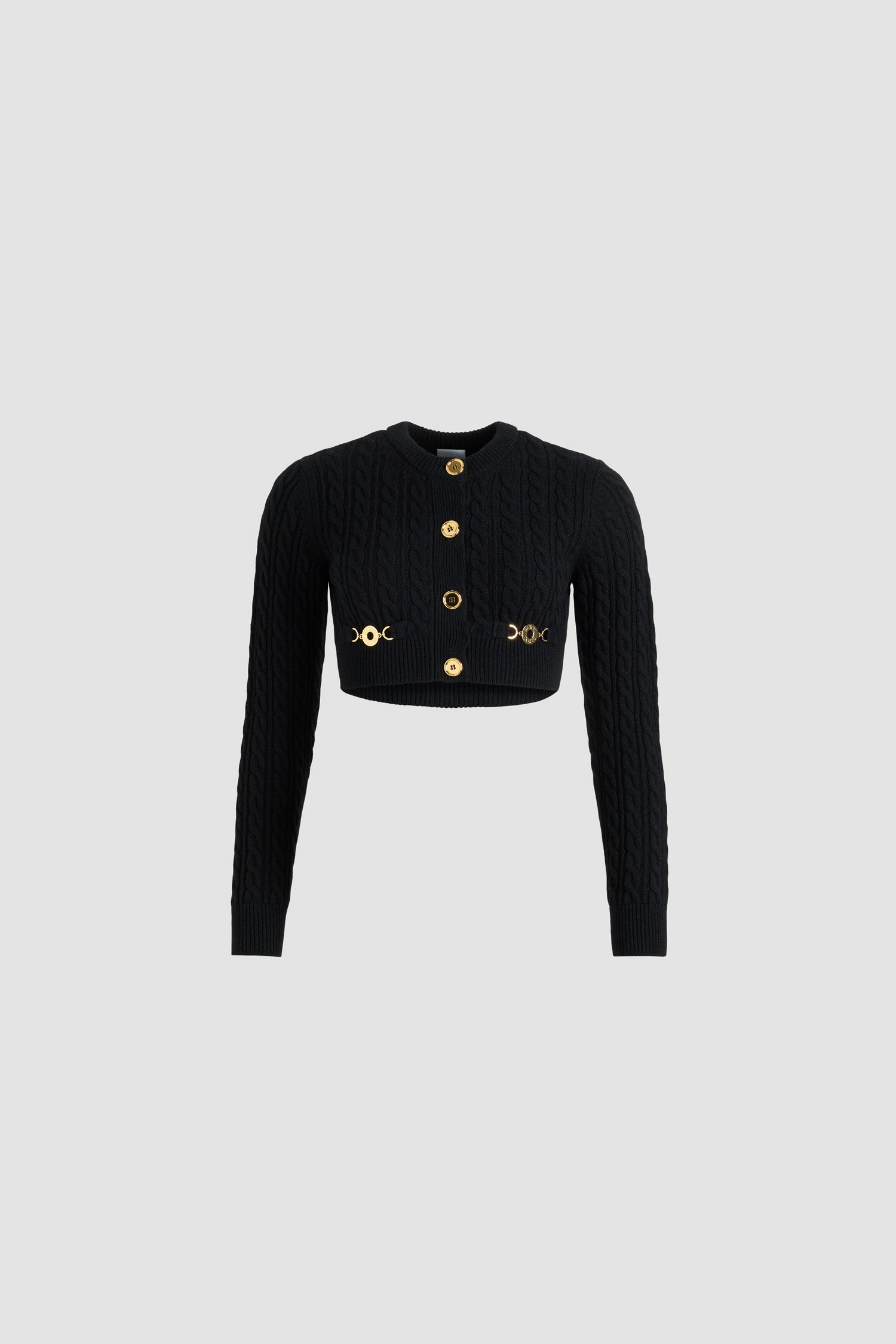 Patou - Cropped cable cardigan in wool and cashmere - Black - Black Merino wool and cashmere cardigan. Cable stitch. Cropped length. Fitted silhouette. Round neck. Button front fastening with gold-tone JP monogram-engraved buttons. Two patch pockets at the front with gold-tone Patou logo-engraved medallion embellishments. Ribbed collar, cuffs and hem.