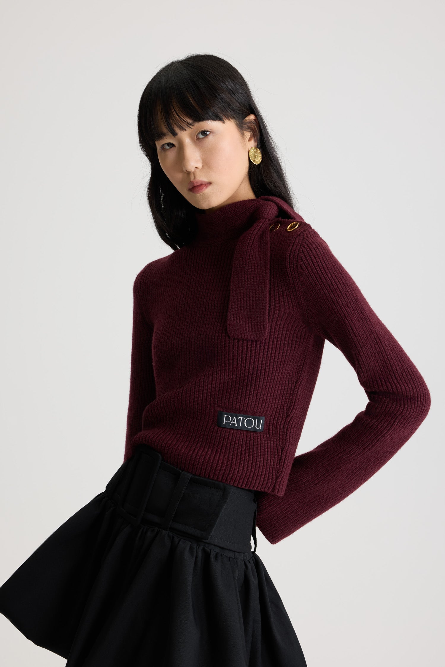 Patou - Scarf collar jumper in wool and cashmere - Vignola - Vignola maroon Merino wool and cashmere jumper. Rib knit. Mock neck with scarf detail. Gold-tone JP-engraved buttons on the shoulder. Patou logo label placed at the front.