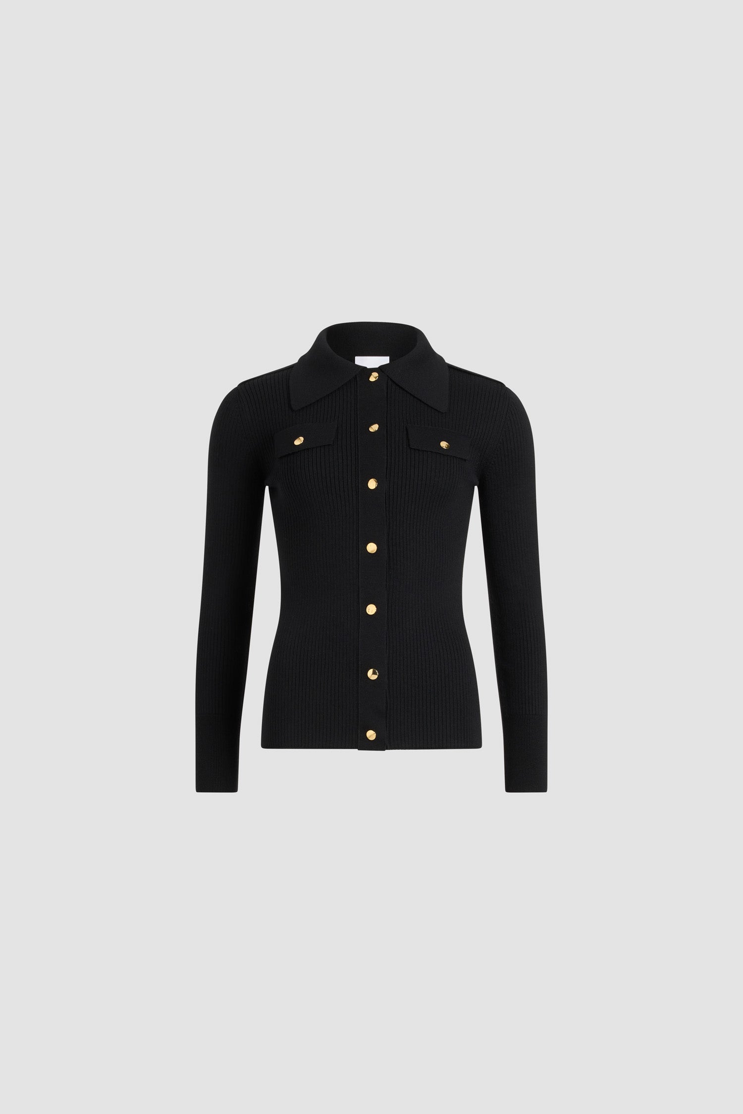 Patou - Camicia a costine in lana - Black - Camicia in lana merino nera. Maglia a costine. Silhouette aderente. Colletto largo. Chiusura sul davanti con bottoni a pressione argento incisi con monogramma JP. Mostrine sulle spalle. Finti taschini sul petto con pattina.
