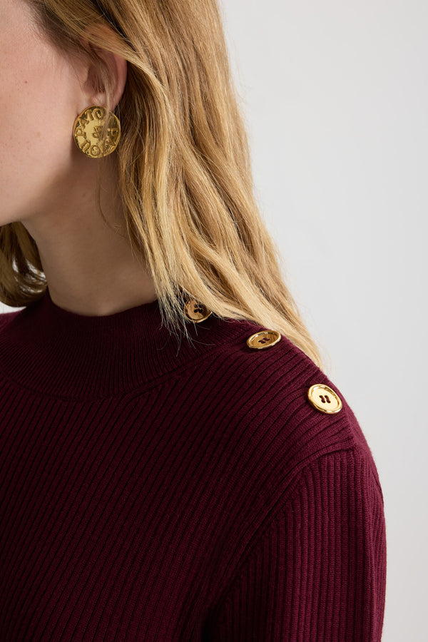 Patou - Ruffle hem ribbed mini dress in wool and faille - Syrah - Syrah burgundy Merino wool dress. Rib knit. Short length. Fitted silhouette. Mock neck. Gold-tone JP-engraved buttons on the shoulder. Elongated sleeves with split cuffs. Polyester faille ruffle hem.