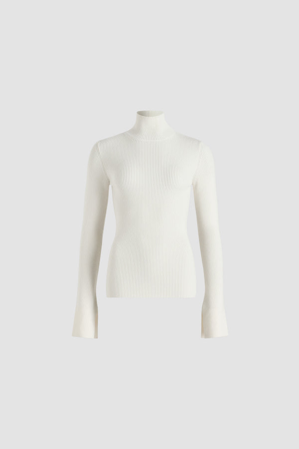 Patou - Ribbed jumper in wool blend - Snowberry White - Snowberry White Merino wool blend jumper. Rib knit. Fitted silhouette. High neck. Elongated sleeves with split cuffs.