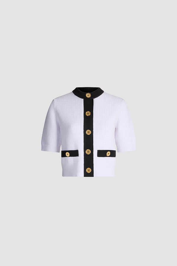 Patou - Cardigan texturé sans col en coton mélangé éco-responsable - White - Cardigan texturé sans col blanc. Manches courtes. Col rond. Bordures contrastées. Fermeture boutonnée.