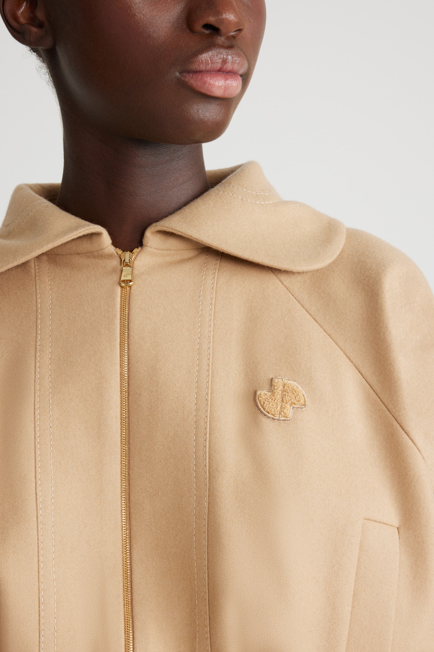 Patou - Lightweight bomber in sustainable wool blend - Gray Sand - Sand sustainable wool blend flannel bomber. Rounded collar. Raglan sleeves. Gold-tone two-way zip fastening. Bouclette JP patch at the chest. Vertical welt pockets. Ribbed waist and cuffs. Lined.