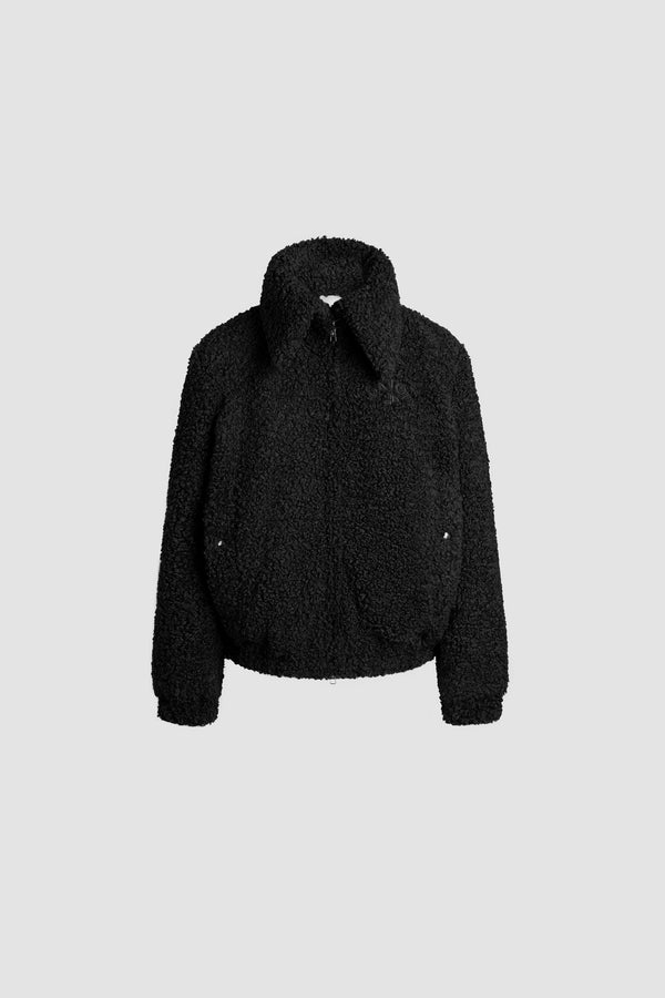 Patou - Bomber a collo alto in pelliccia ecologica riciclata - Black - Giacca in pelliccia ecologica riciclata nera. Colletto largo. Zip argento a doppio cursore sul davanti. Logo Patou e monogramma JP ricamati sul petto. Tasche a filetto verticali con bottoni a pressione argento incisi con monogramma JP. Fondo e polsini elasticizzati.