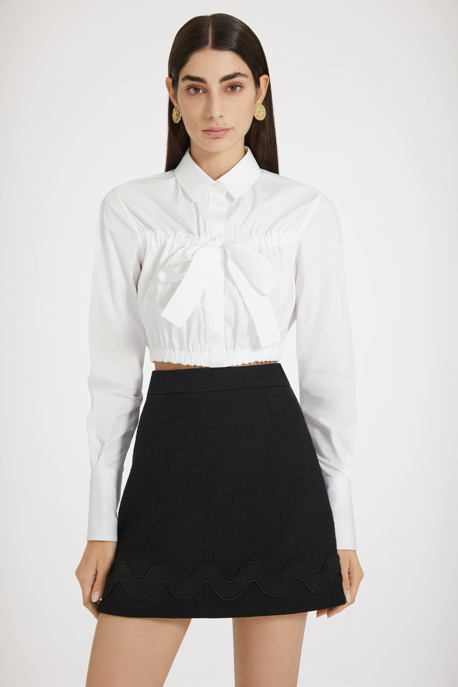 Patou - Wave mini skirt in cotton tweed - Black - Minis to suit all moods.Black cotton tweed skirt. High waist. Short length. Zip fastening at the back. Darts at the front and back. Contrast wave trim.