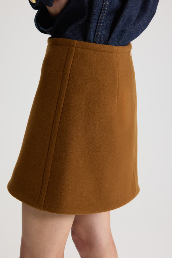 Patou - A-line mini skirt in sustainable wool blend - Mahogany - Mahogany sustainable wool blend skirt. Short length. Mid waist. A-line silhouette. Zip fastening at the back. Darts at the back. Lined.