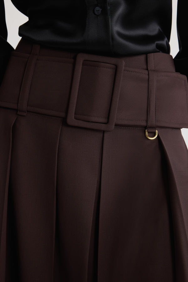 Patou - Belted midi skirt in sustainable technical wool - Smoked Ebony - Smoked Ebony sustainable technical wool twill skirt. Midi length. Mid waist. Wide box pleats. Zip fastening at the back. Wide fabric belt with fabric-covered buckle and gold-tone D-ring. Lined.