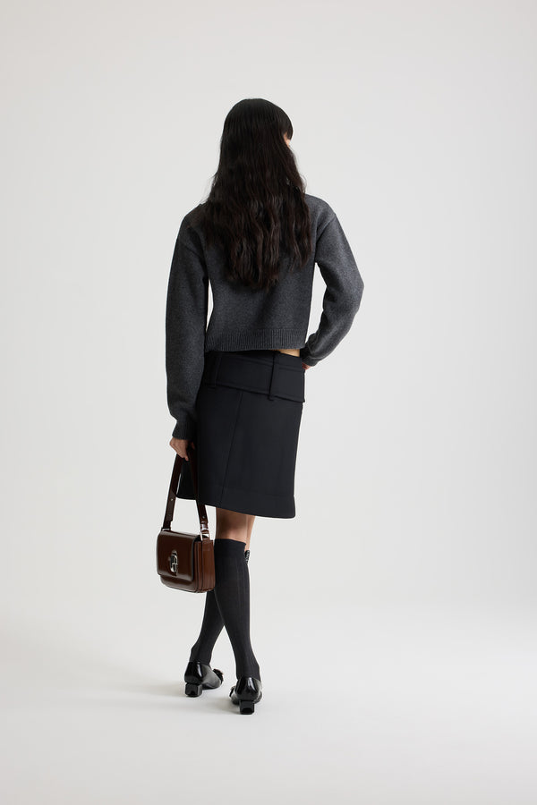Patou - Zip front belted mini skirt in wool - Black - Black wool skirt. Short length. Low waist. Gold-tone two-way zip fastening at the front. Wide fabric belt at the hips with fabric-covered buckle and gold-tone D-ring. Low pockets at the front. Lined.
