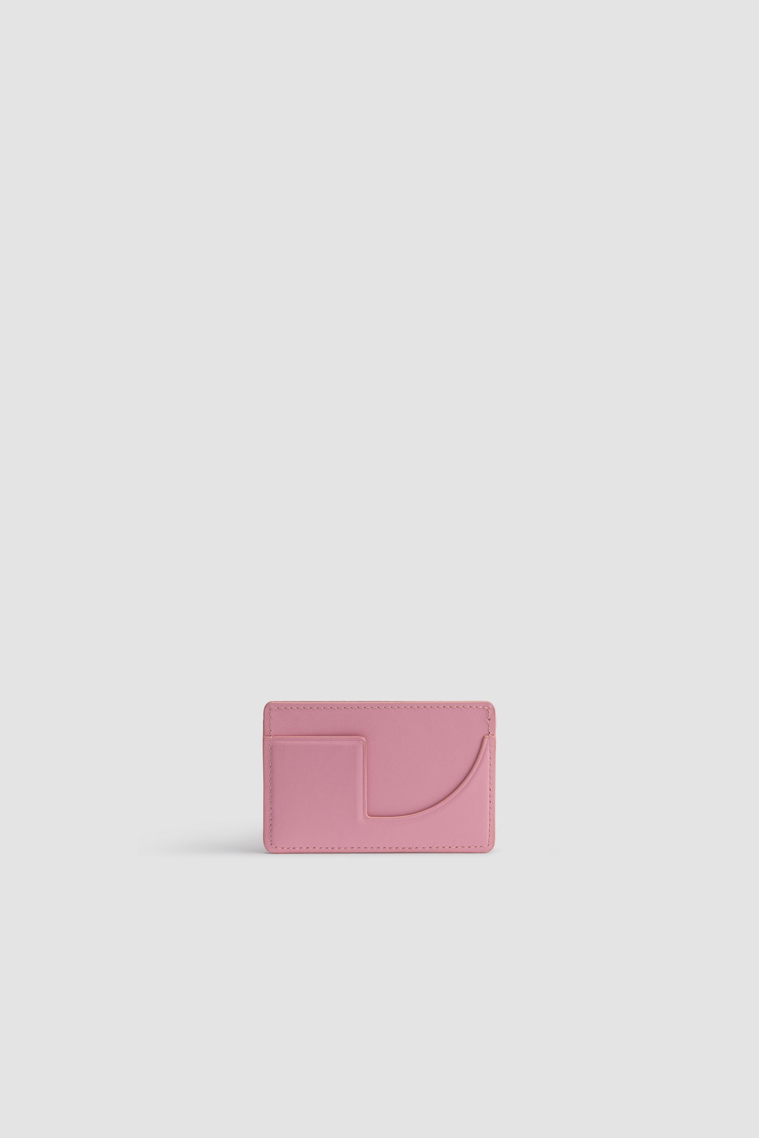 Patou - JP cardholder in leather - Rosebloom Pink - Rosebloom Pink leather cardholder. Two card slots, central compartment. Gold embossed Patou at the front, cut-out at the back.