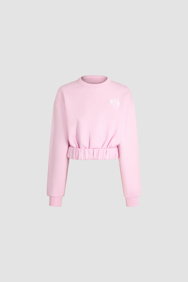 Patou - Patou x Hôtel Du Cap-Eden Roc Cropped Sweatshirt In Organic Cotton - Candy Pink - A summer capsule collection exclusively available at Hôtel du Cap-Eden-Roc.Pink sweatshirt in organic cotton. Cropped fit. High neck. Gathered waist. Long sleeves. Patou logo on the chest.