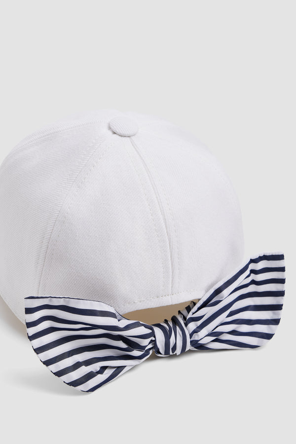 Patou - Patou x Hôtel Du Cap-Eden Roc Couture Cap In Cotton - White - A summer capsule collection exclusively available at Hôtel du Cap-Eden-Roc.White cotton cap. Patou logo on the front. Blue and white striped bow detail stitched at the back.