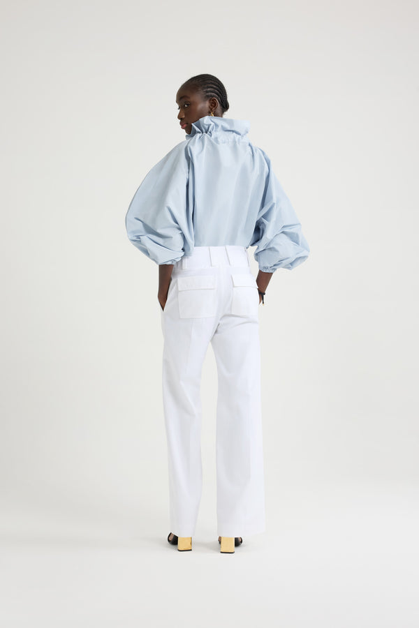 Patou - Iconic drawstring top in recycled faille - Pearl Blue - Pearl Blue recycled polyester faille top. High volume silhouette that can be worn knotted at the neck or off the shoulders. Drawstring collar with flounce at the front and long grosgrain ties. Batwing sleeves with elasticated cuffs. Elasticated waist.