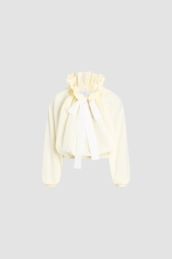 Patou - Top iconico voluminoso a righe in cotone biologico - Lemonade Stripes - Top iconico voluminoso a righe gialle e bianche in cotone biologico. Silhouette molto voluminosa che può être indossata annodata al collo o con le spalle scoperte. Colletto a coulisse con arricciatura frontale e lunghi lacci in gros-grain. Maniche a pipistrello con polsini elasticizzati. Vita elasticizzata.