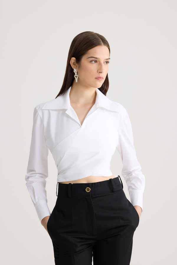 Patou - Organic Cotton Long Sleeve Knotted Top - White - White long sleeve top. Organic cotton material. V-neck. Knot at the back.