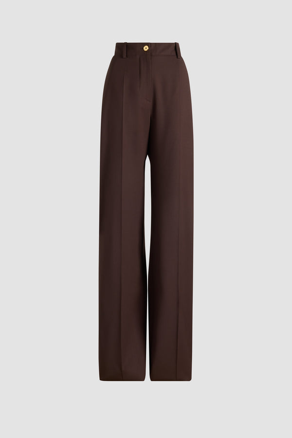 Patou - Iconic long trousers in sustainable technical wool - Smoked Ebony - Smoked Ebony sustainable technical wool twill trousers. Iconic Patou silhouette. Long straight fit. Fastens via a gold-tone JP monogram-engraved button and concealed zip at the front. Belt loops. Pockets at the sides. Signature darts at the back.