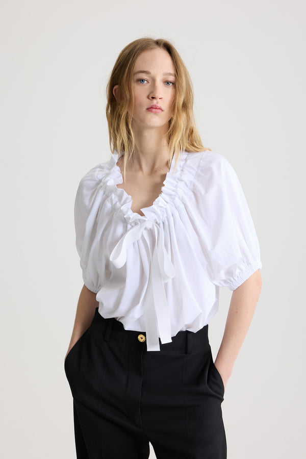 Patou - Iconic long trousers in virgin wool - Black - Black stretch virgin wool trousers. Iconic Patou silhouette. Straight fit. Fastens via a gold-coloured JP-engraved button and zip at the front. Belt loops, two pockets at the sides. Signature darts at the back.