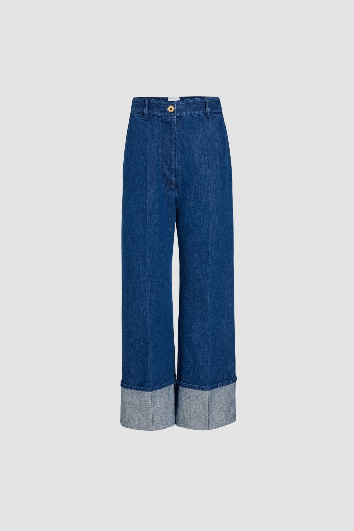 Patou - Iconic trousers in organic cotton denim - Stonewash - Stonewash organic cotton denim trousers. Iconic Patou silhouette. Long straight fit. Contrast stitching all over, gold-tone Patou-engraved button and zip fastening at the front. Belt loops, two pockets at the sides. Signature darts at the back.This style sits on the hips. If you want to wear it higher on the waist, we suggest you select one size down.