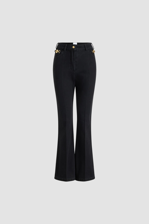 Patou - Flared trousers in organic cotton denim - Khol Stone - Khol Stone black organic cotton denim trousers. Flared leg. Mid rise. Gold-tone Patou-engraved button at the front. Belt loops. Embroidered Patou at the waistband. Darts and crease at the front and back. Two pockets at the front with removable gold-tone Patou-engraved ornaments. Signature curved seam at the back.This style is fitted at the waist.