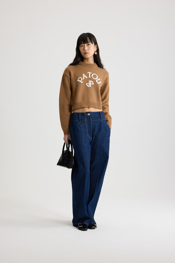 Patou - Wide waistband trousers in cotton denim - Rodeo Blue - Rodeo Blue cotton denim trousers. Mid to low waist. Straight leg. Belt loops. Fastens via a gold-tone Patou logo-engraved button and concealed zip at the front. Pockets at the sides. Pressed crease at the front.